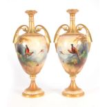 A. LEWIS. A PAIR OF ROYAL WORCESTER VASES of ovoid shape on socle feet with slender gilt necks and