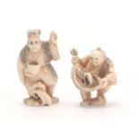 A PAIR OF JAPANESE IVORY NETSUKE one modelled as a man holding his catch of fish, the other