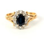A LADIES 18CT GOLD SAPPHIRE AND DIAMOND RING app. 3.2g