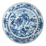 A 17TH / 18TH CENTURY CHINESE BLUE AND WHITE DISH decorated with figures in a garden and on horse