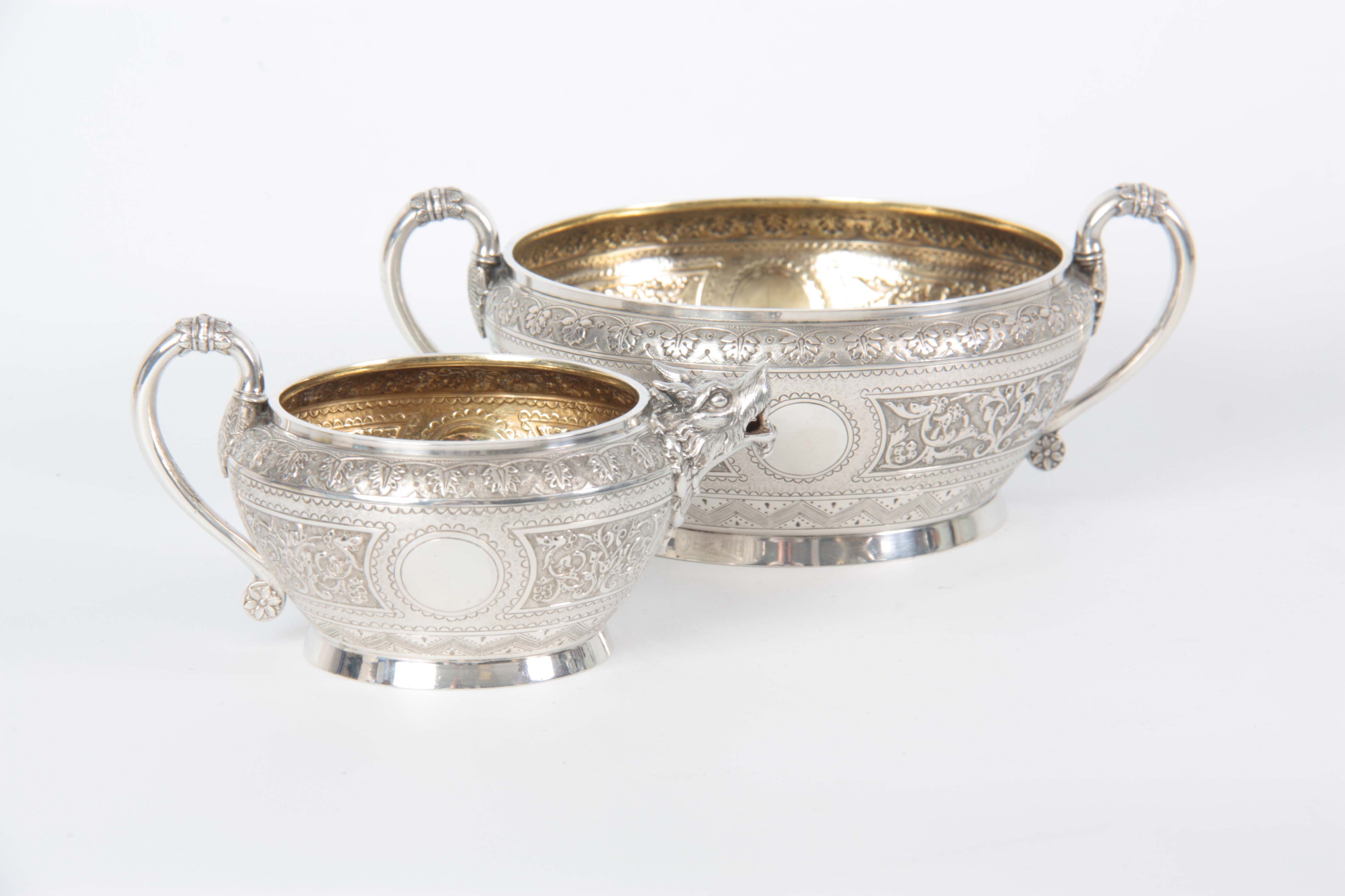 A VICTORIAN SILVER AND GILT CREAM JUG AND SUGAR BOWL having relief scroll-work panels and fine - Image 2 of 7