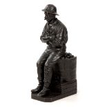 E GEFLAWSKI. A LATE 19TH CENTURY LARGE BRONZE SCULPTURE depicting a coalminer seated on a coal