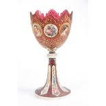 A 19TH CENTURY BOHEMIAN RUBY AND WHITE OVERLAY GLASS ENAMELLED GOBLET decorated with enamelled