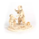 A LATE 19TH CENTURY MEIJI JAPANESE CARVED IVORY FIGURE GROUP modelled as a travelling Magician