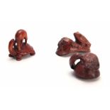 A COLLECTION OF THREE EARLY 20th CENTURY HARDWOOD NETSUKE sculptured as various animals all with