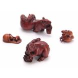 A COLLECTION OF FOUR EARLY 20th CENTURY NETSUKE sculptured as various animals all with character