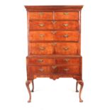 AN EARLY 18TH CENTURY FIGURED WALNUT CHEST ON STAND with moulded cornice above a drawer