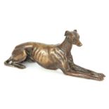 A LATE 19th CENTURY PATINATED BRONZE SCULPTURE modelled as a recumbent greyhound 26cm long