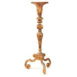 A LARGE 19th CENTURY CARVED GILT GESSO TORCHERE with acanthus leaf tapering stem supported on a