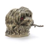 A LATE 19th CENTURY CAST NICKLE NOVELTY INKWELL modelled as a dogs head with red glass eyes and