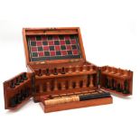 A VICTORIAN MAHOGANY GAMES COMPENDIUM WITH JAQUES MONOGRAM having a hinged fold-out front and lid