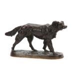 A LATE 19th CENTURY PATINATED BRONZE SCULPTURE modelled as a standing gun dog on naturalistic base