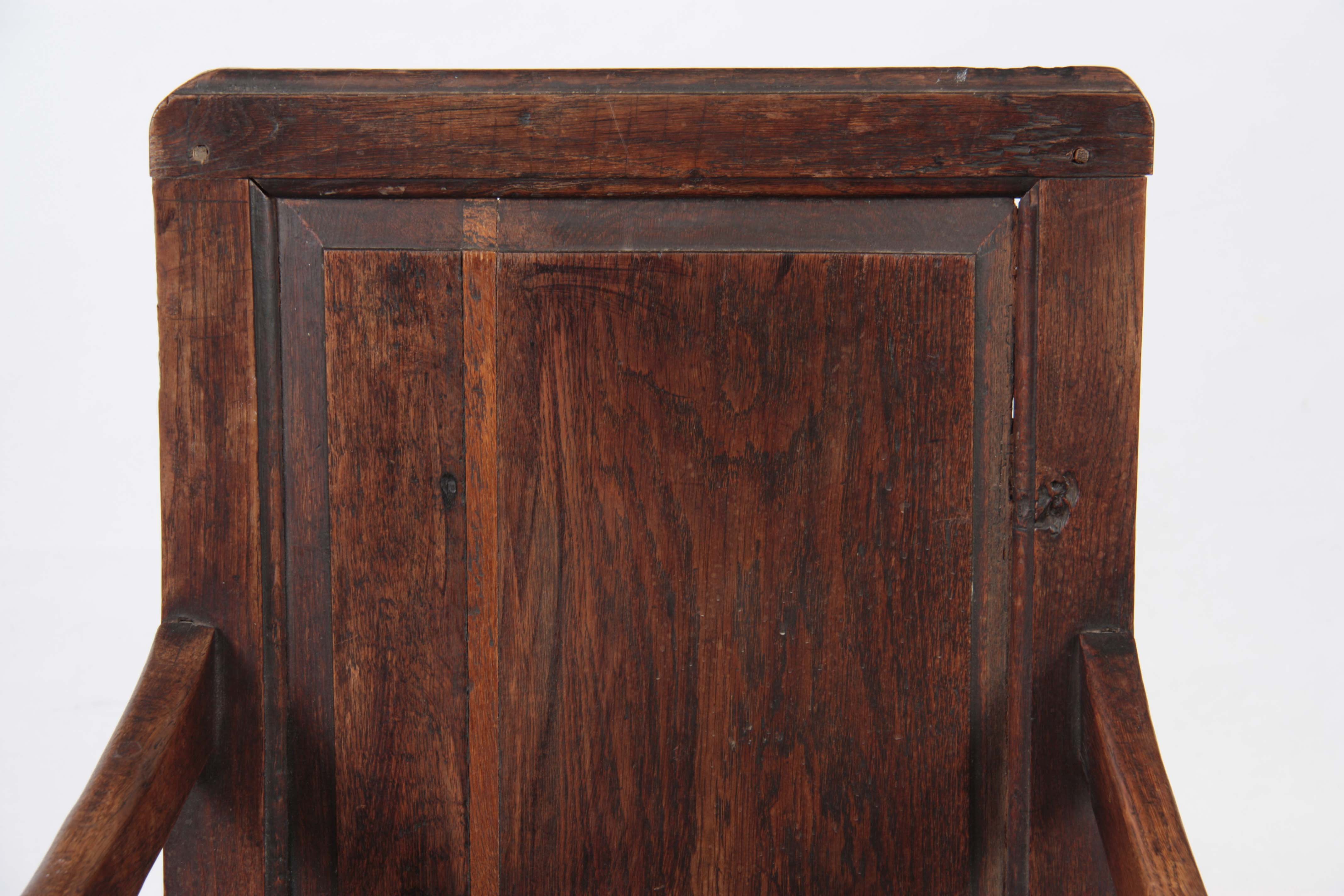AN EARLY 18TH CENTURY OAK WAINSCOT CHAIR having fielded panel back with open arms and turned - Image 2 of 5
