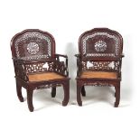 A PAIR OF 20TH CENTURY CHINESE HARDWOOD ARMCHAIRS