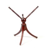 A REGENCY EBONISED INLAID MAHOGANY CAT / BOWL STAND with ring turned revolving top above a tripod