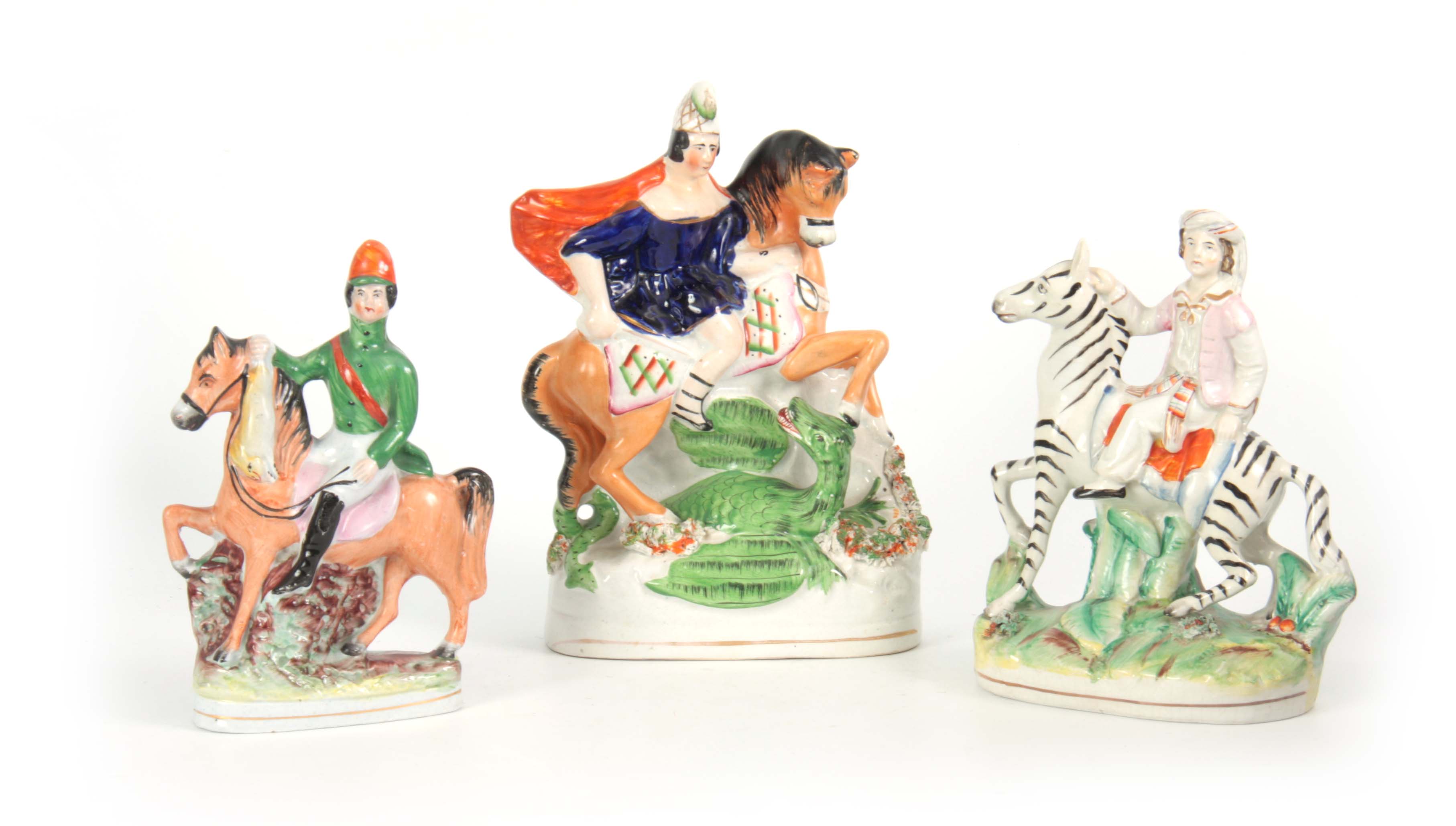 A SELECTION OF THREE 19TH CENTURY STAFFORDSHIRE EQUESTRIAN FIGURES comprising of a Turkish figure