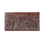 AN 18TH CENTURY CONTINENTAL CARVED OAK PANEL depicting finely carved figures in a village setting