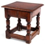 A 17th Century style joined Oak STOOL the dowelled moulded edge seat on ringed turned legs and
