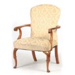 A GEORGE I STYLE WALNUT UPHOLSTERED ARM CHAIR with