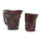 TWO CHINESE CARVED HORN LIBATION CUPS the larger d