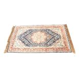 A SILK TURKISH RUG 150cm wide 94cm deep