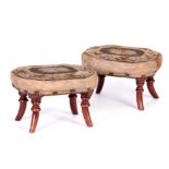 A PAIR OF REGENCY MAHOGANY FOOT STOOLS with splayed legs and tapestry tops 28cm wide 22cm deep