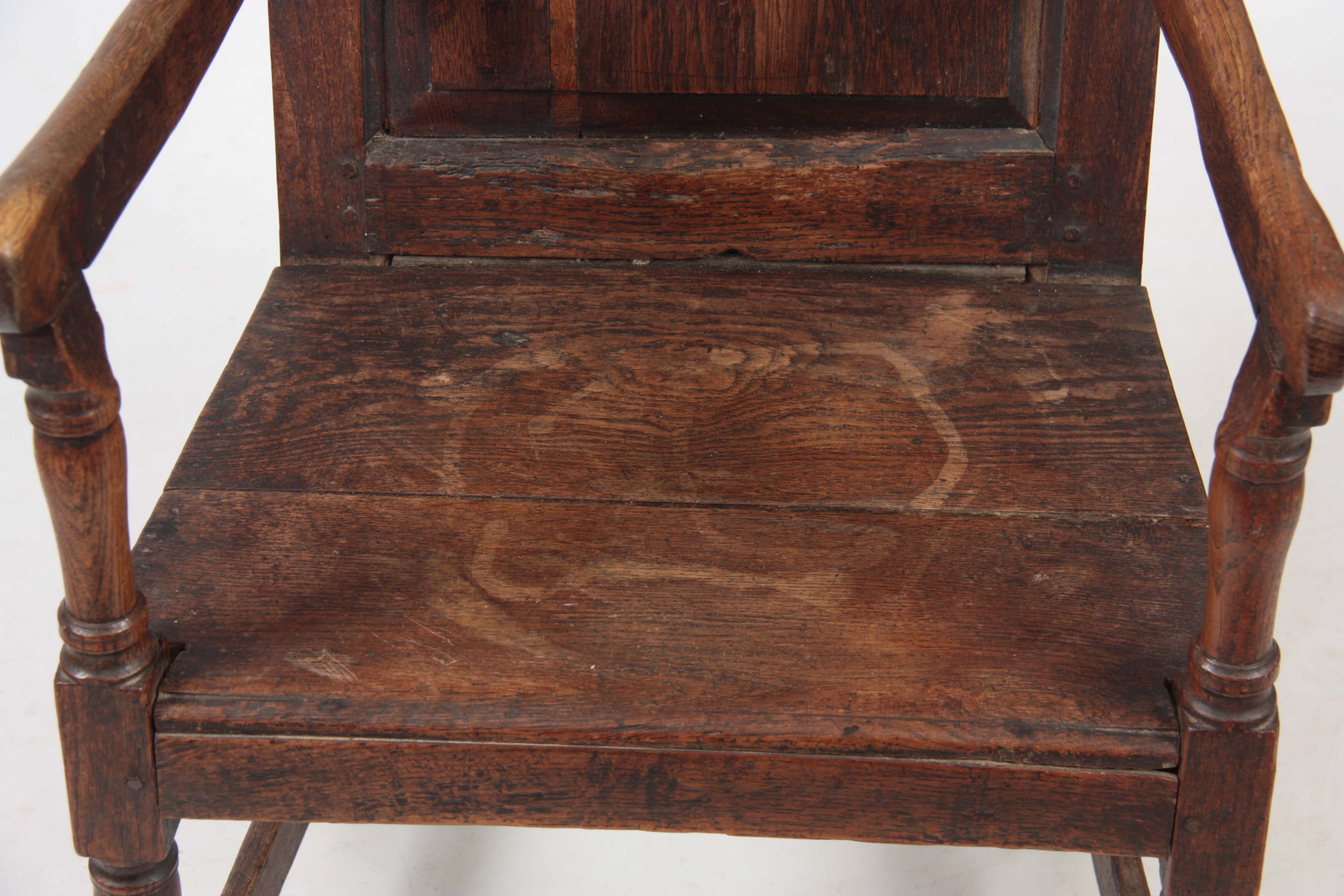 AN EARLY 18TH CENTURY OAK WAINSCOT CHAIR having fielded panel back with open arms and turned - Image 3 of 5