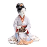 A FINE JAPANESE MEIJI PERIOD KUTANI BIJIN FIGURE OF A SEATED GIRL with cranes and floral