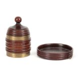 A LATE GEORGIAN BRASS BOUND RIBBED MAHOGANY TOBACCO JAR of conical shape with ball finial to the lid