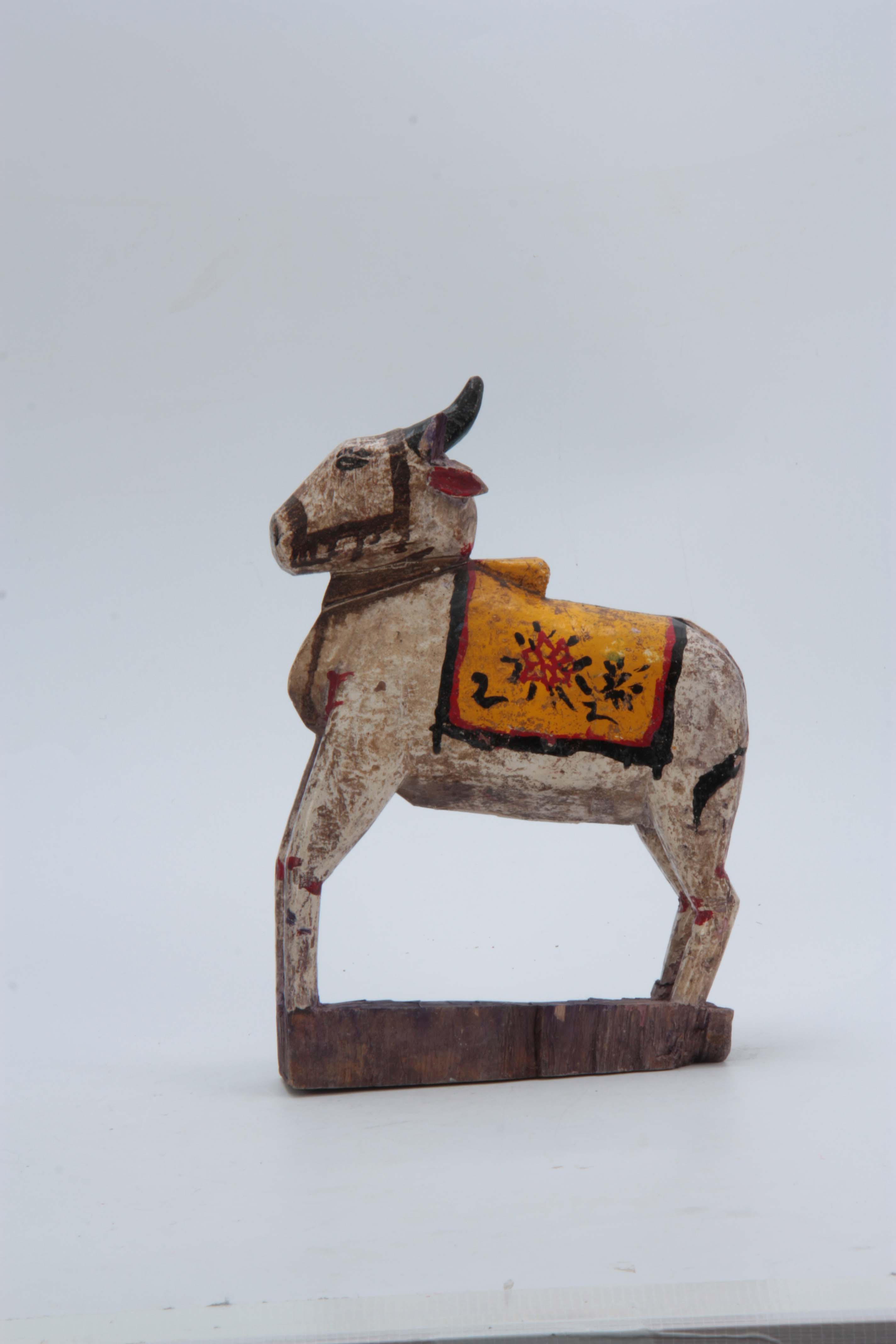 A CARVED AND PAINTED HINDU NANDI COW 31cm high 20c - Image 3 of 8