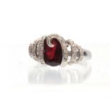 A 14ct WHITE GOLD RUBY AND DIAMOND RING having an