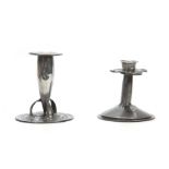 TWO ARTS AND CRAFTS PEWTER CANDLESTICKS the taller