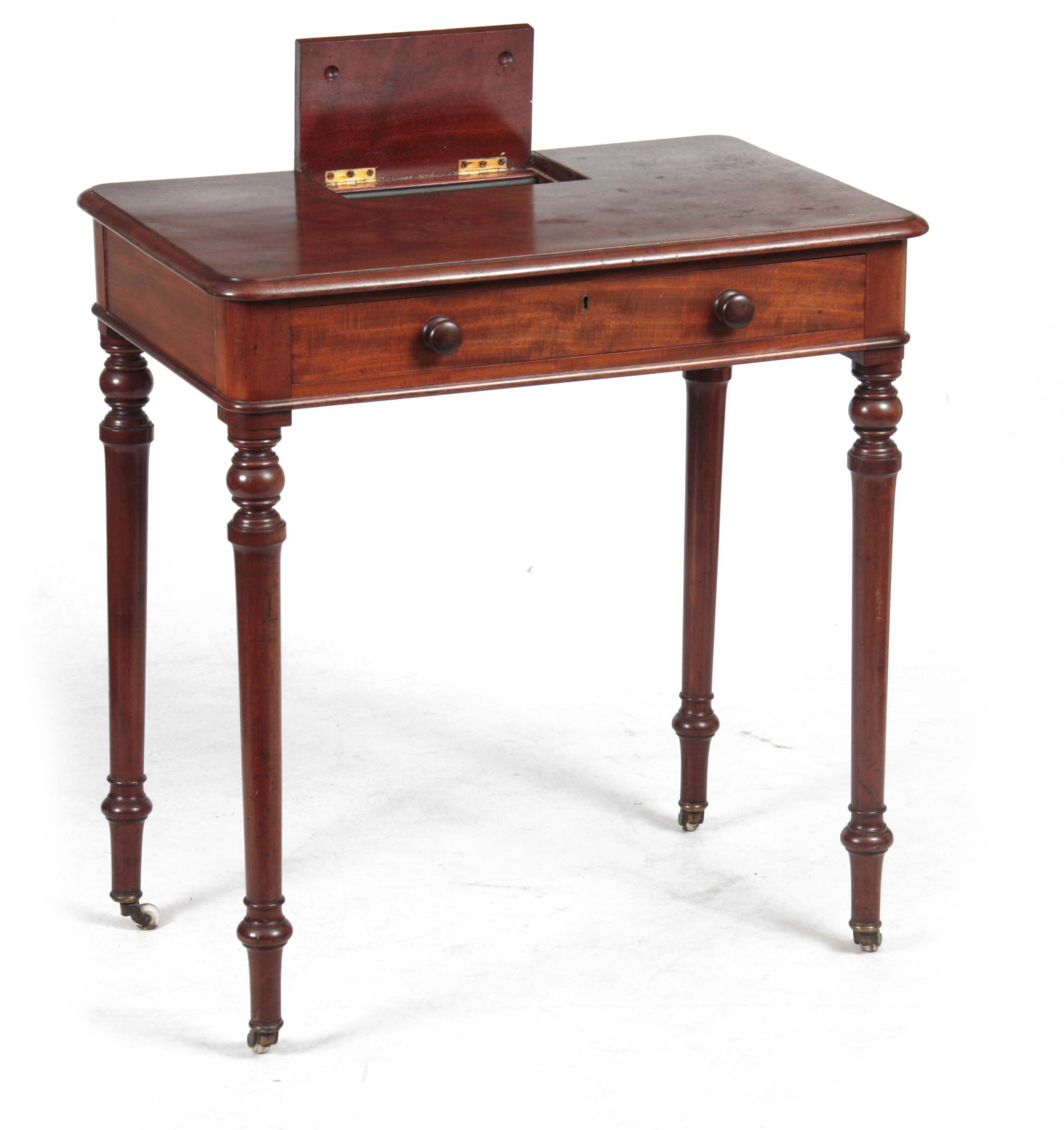 AN EARLY 19TH CENTURY MAHOGANY WRITING TABLE IN TH