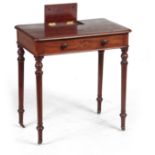 AN EARLY 19TH CENTURY MAHOGANY WRITING TABLE IN TH