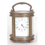 A LATE 20th CENTURY OVAL CASED CARRIAGE CLOCK havi