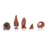 A COLLECTION OF FIVE EARLY 20th CENTURY NETSUKE sculptured as various animals and figures, all