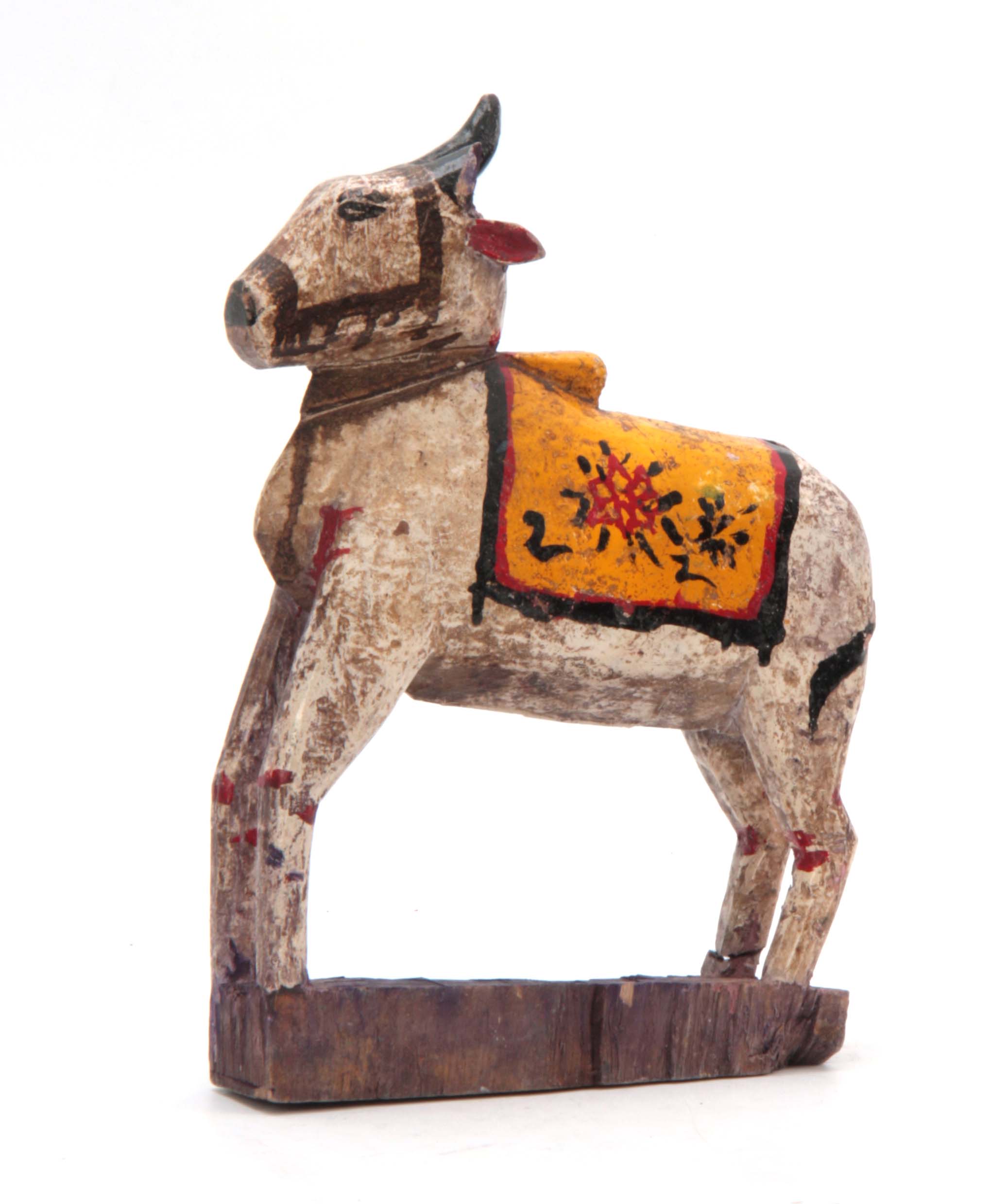 A CARVED AND PAINTED HINDU NANDI COW 31cm high 20c