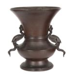 AN 18TH / 19TH CENTURY CHINESE BRONZE VASE having a tapering rim and shaped foot, mounted with
