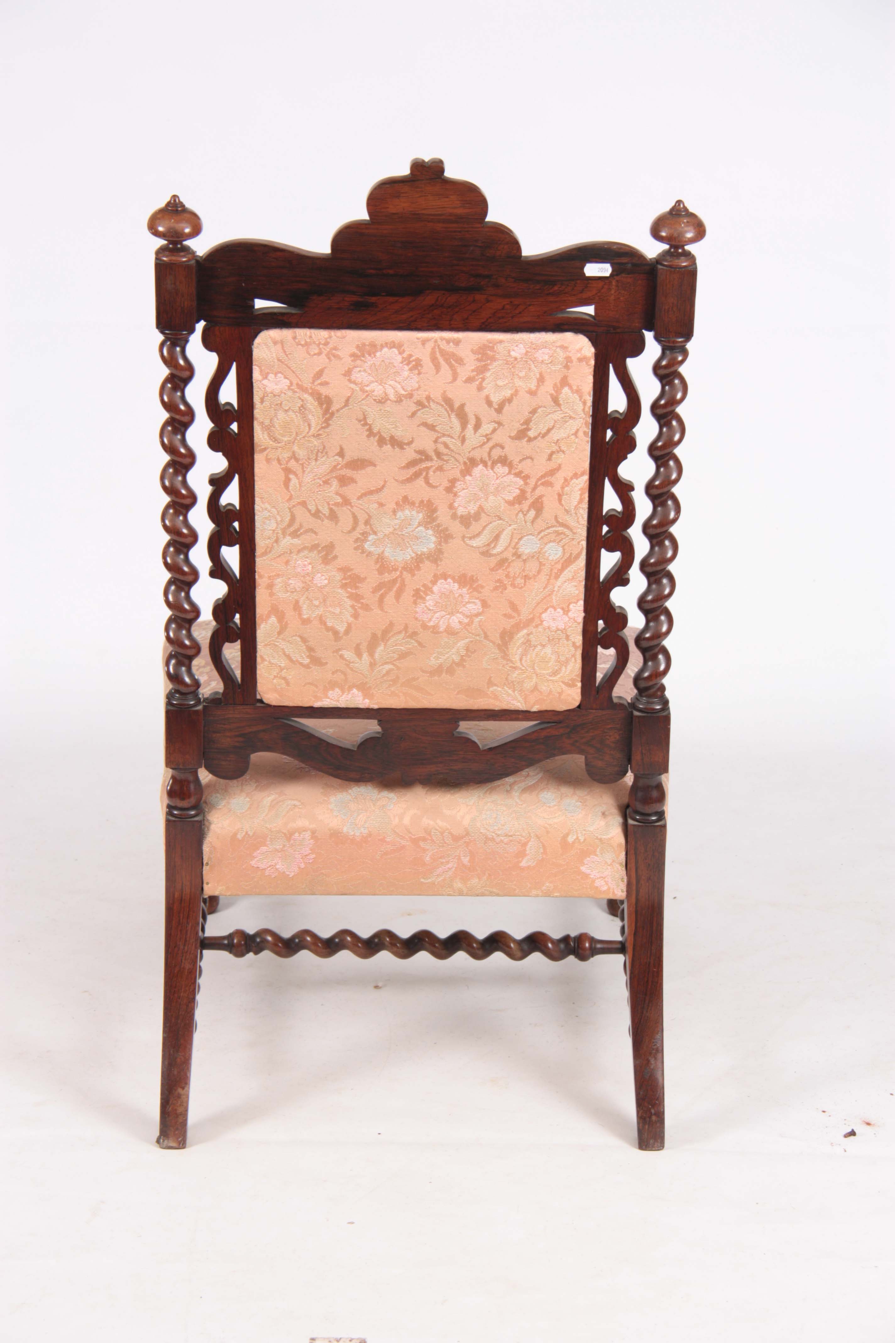A MID VICTORIAN ROSEWOOD UPHOLSTERED ROSEWOOD NURSING CHAIR with leaf carved top rail, barley - Image 6 of 6