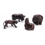 A COLLECTION OF FOUR EARLY 20th CENTURY NETSUKE sculptured as various animals three with character