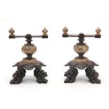 A PAIR OF VICTORIAN BRONZE AND IRON FIRE DOGS havi