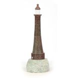 AN UNUSUAL MARBLE SCULPTURE OF A LIGHTHOUSE of turned tapering form with glass top mounted on a