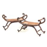 A PAIR OF SIMULATED ROSEWOOD BERGERE WINDOW SEATS of X frame design with scrolled arms and splayed