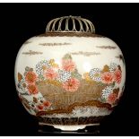 A LATE 19TH CENTURY JAPANESE SATSUMA BULBOUS KORO with filigree silvered flower head cover, the body