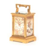 A LATE 19TH CENTURY FRENCH GILT BRASS PORCELAIN PANELLED REPEATING CARRIAGE CLOCK WITH ALARM bearing