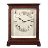 AN EARLY 20TH CENTURY GERMAN MAHOGANY FOUR-GLASS QUARTER CHIMING MANTEL CLOCK the moulded case