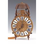 AN EARLY 18TH CENTURY FRENCH LANTERN CLOCK the 5" brass dial with applied porcelain blue Roman