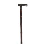 A VICTORIAN ROLAND WARD HORSE MEASURING WALKING STICK with horn handle cut in half to conceal a