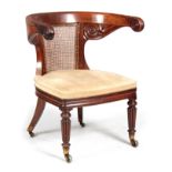 A FINE LATE REGENCY MAHOGANY GENTLEMAN'S BERGERE LIBRARY ARM CHIAR IN THE MANNER OF GILLOWS of