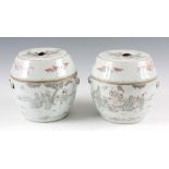 A PAIR OF 19TH CENTURY CHINESE STORAGE JARS AND COVERS with angled shaped lids and bulbous bodies,